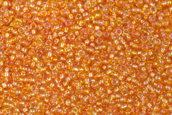 PRECIOSA rokajl 10/0 (2,2 - 2,4 mm) RH, bal. 50 g - transparentní topaz, rainbow