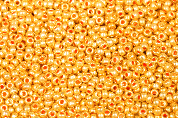 PRECIOSA rokajl 8/0 (2,8 - 3,2 mm) RH, bal. 50 g - metalická zlatá, oranžovozlatá