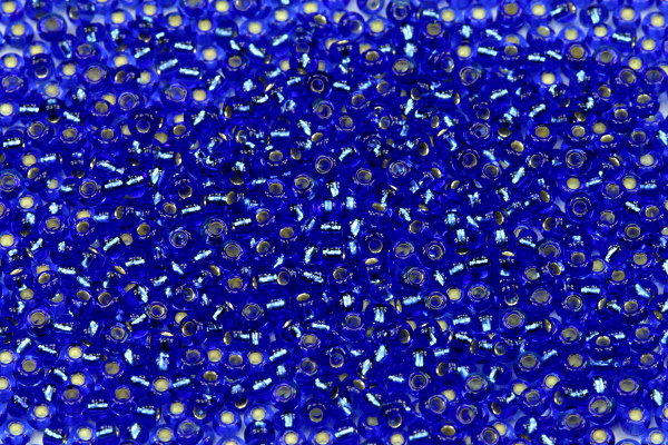 PRECIOSA rokajl 9/0 (2,4 - 2,8 mm) RH, bal. 50 g - transp. safírově modrá, SL