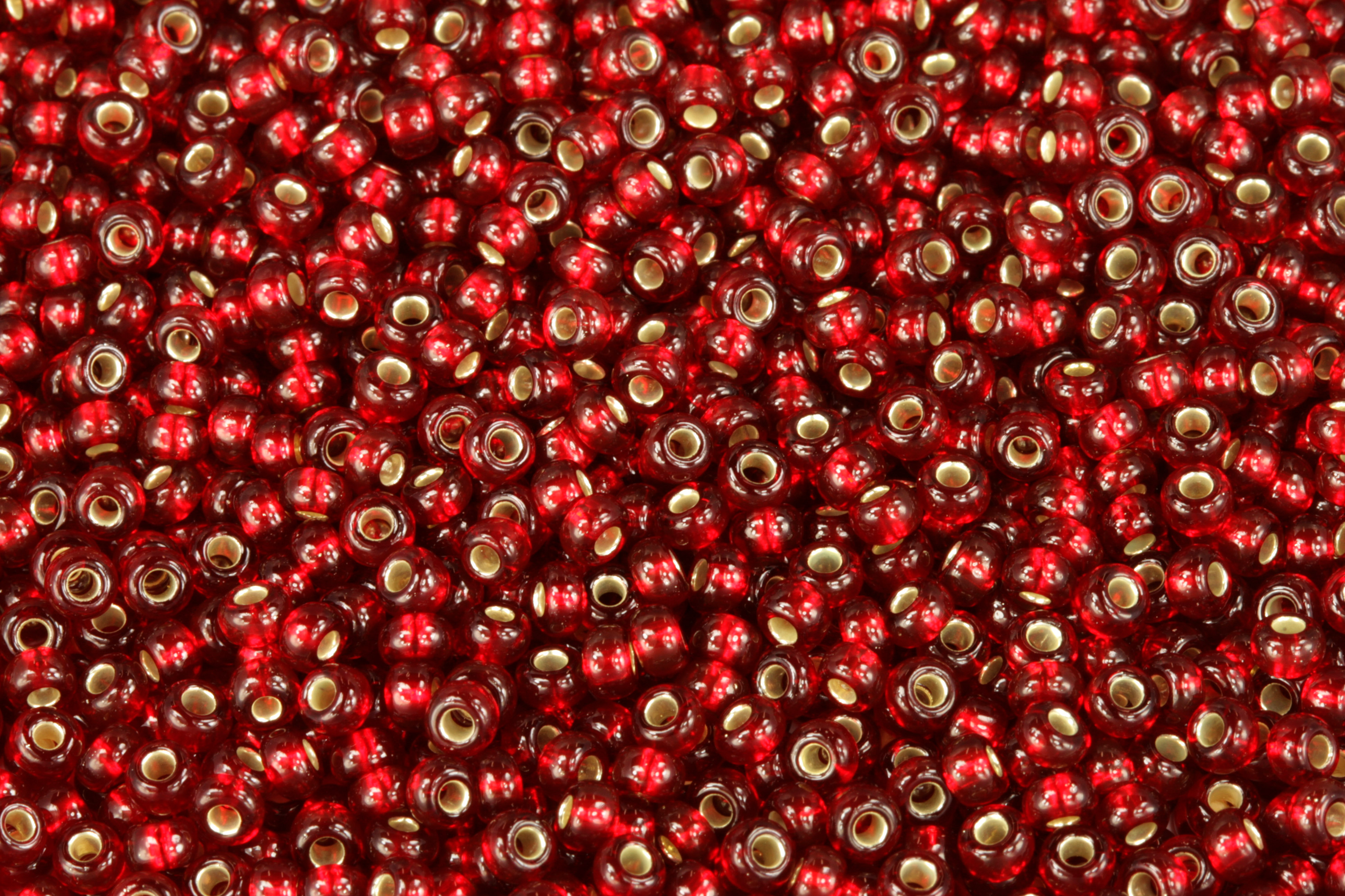 PRECIOSA rokajl 8/0 (2,8 - 3,2 mm) RH, bal. 50 g - transparentní rubínově červená, SL