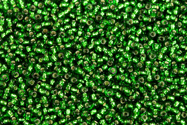PRECIOSA rokajl 10/0 (2,2 - 2,4 mm) RH, bal. 50 g - transparentní chrysolitově zelená, SL