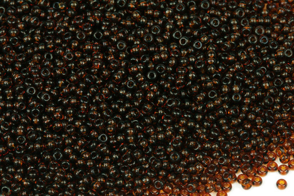 PRECIOSA rokajl 11/0 (2,0 - 2,2 mm) SH, bal. 50 g - transparentní tmavý topaz, hnědá
