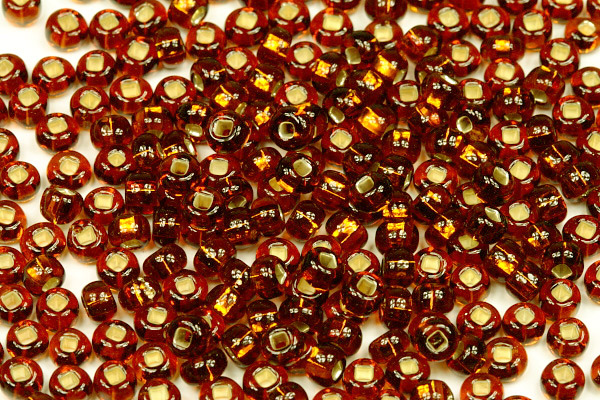 Rokajl Preciosa 6/0 (3,7 - 4,3 mm) SH, bal. 50 g - transp. topaz, stříbrný průtah (SL)
