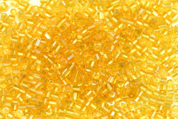 PRECIOSA dvoukrátky (2cuts) 9/0 (2,2 - 2,5 mm) RH, bal. 50 g - transparent. topaz, rainbow