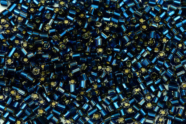 PRECIOSA™ dvoukrátky (2cuts) 9/0 (2,2 - 2,5 mm) RH, bal. 50 g - trans. tmavý akvamarín, SL