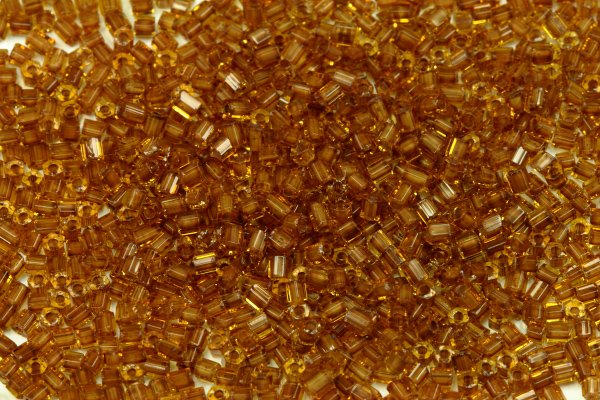 PRECIOSA dvoukrátky (2cuts) 10/0 (2,0-2,2 mm) RH, bal. 50 g - topaz, hnědý průtah