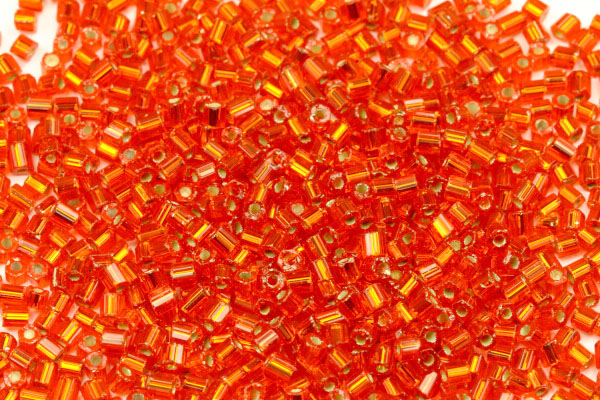 PRECIOSA dvoukrátky (2cuts) 10/0 (2,0-2,2 mm) RH, bal. 50 g - transp. oranžová, SL