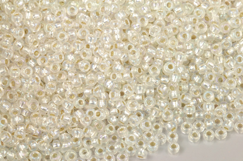 Rokajl Preciosa 8/0 (2,8 - 3,2 mm) RH, bal. 50 g - krystal, SL, rainbow