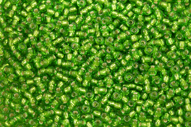 Rokajl Preciosa 8/0 (2,8 - 3,2 mm) RH, bal. 50 g - transp. zelená peridot, SL