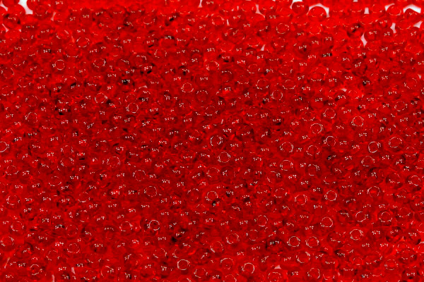 Rokajl Preciosa 11/0 (2,0 - 2,2 mm) RH, bal. 50 g - transp. rubínově červená