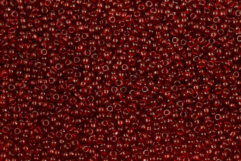 TOP Rokajl Preciosa 10/0 (2,2 - 2,4 mm) RH, bal. 50 g - trans. rubínově červená (90090)