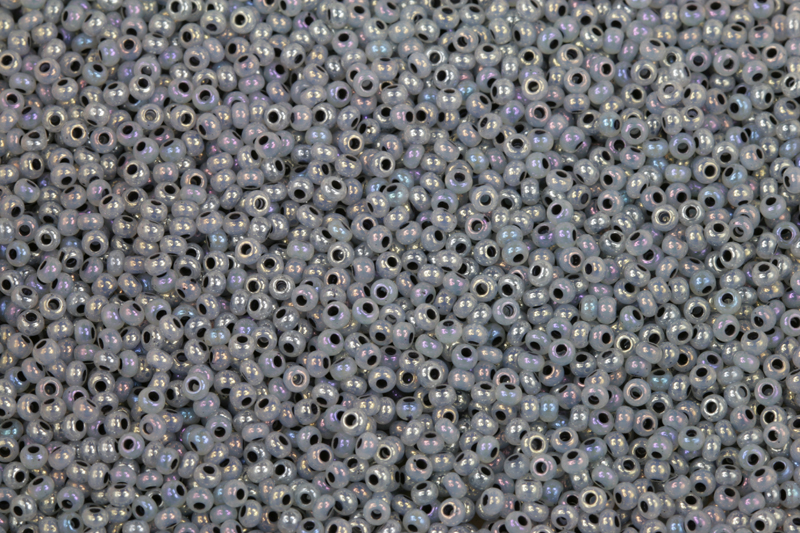 Rokajl Preciosa 10/0 (2,2 - 2,4 mm) RH, bal. 50 g - fialovomodrošedá, šedý vtah, rainbow