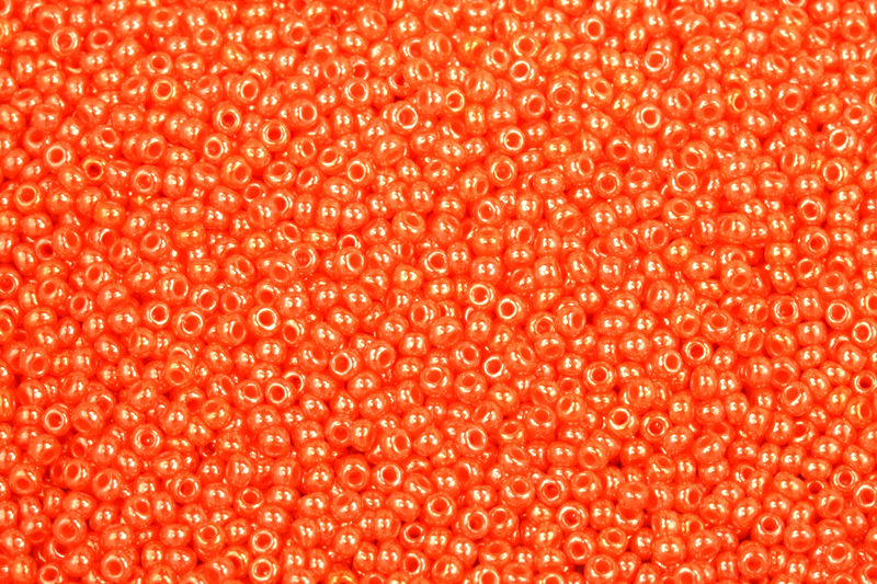 PRECIOSA rokajl 10/0 (2,2 - 2,4 mm) RH, bal. 50 g - sytá červenooranžová (koralín), sfinx