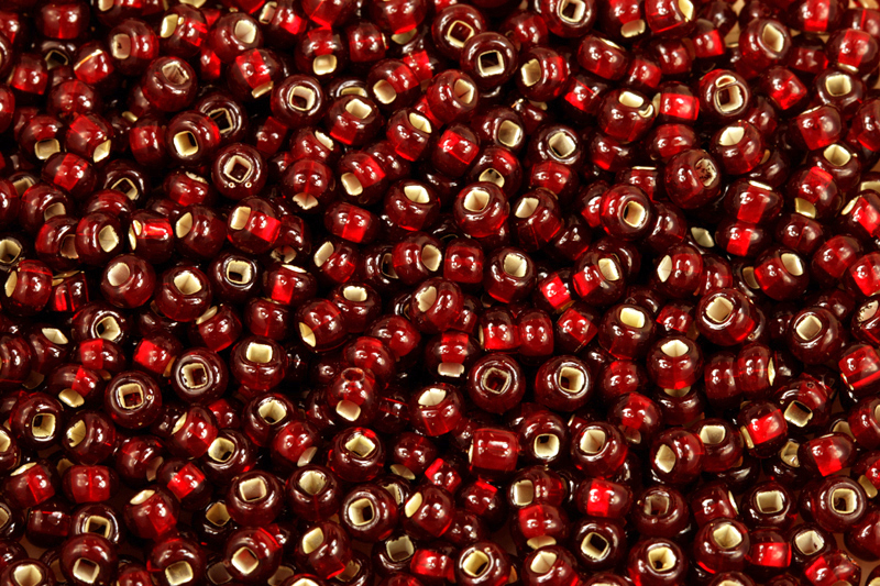 PRECIOSA rokajl 6/0 (3,7 - 4,3 mm) SH, bal. 50 g - transp. rubínově červená, SL