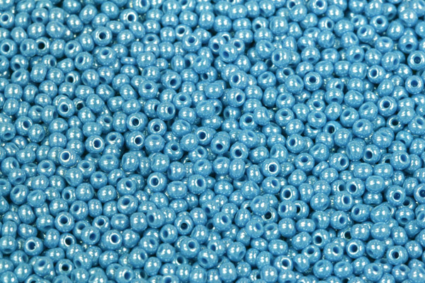 Rokajl Preciosa 10/0 (2,2 - 2,4 mm) RH, bal. 50 g - sytá tyrkysově modrá s listrem, sfinx