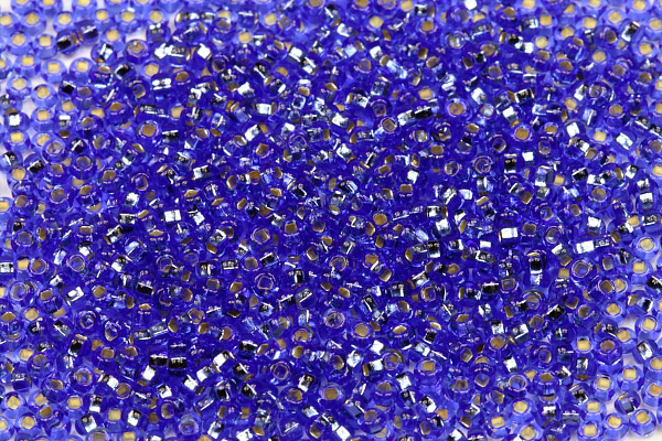Rokajl Preciosa 10/0 (2,2 - 2,4 mm) SH, bal. 50 g - transp. safírově modrá, SL
