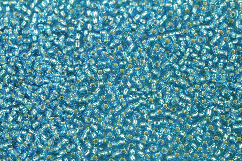 TOP Rokajl Preciosa 10/0 (2,2 - 2,4 mm) RH, bal. 50 g - trans. modrá akvamarín, SL (67030)