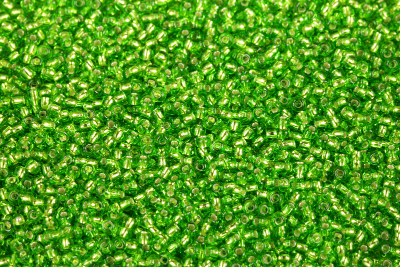 TOP Rokajl Preciosa 11/0 (2,0 - 2,2 mm) RH, bal. 50 g - transp. zelená peridot, SL (57430)