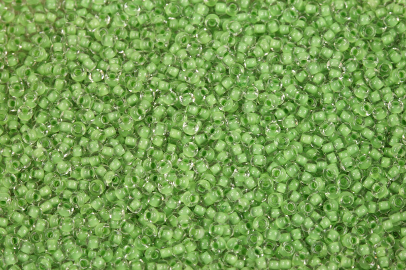 Rokajl Preciosa 10/0 (2,2 - 2,4 mm) RH, bal. 50 g - krystal se zeleným průtahem