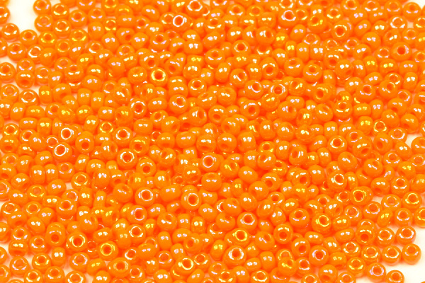 Rokajl Preciosa 10/0 (2,2 - 2,4 mm) RH, bal. 50 g - sytá oranžová, rainbow