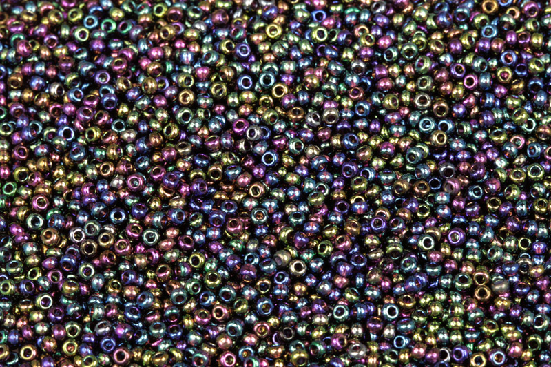 Rokajl Preciosa 11/0 (2,0 - 2,2 mm) RH, bal. 50 g - transp. tmavý ametyst, rainbow