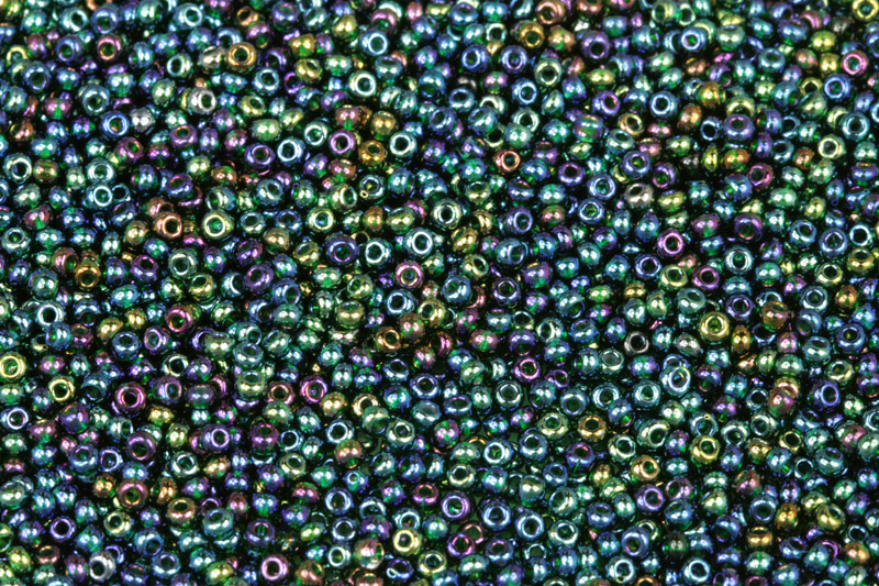 TOP Rokajl Preciosa 10/0 (2,2 - 2,4 mm) RH, bal. 50 g -transp. tm. zelená, rainbow (51150)