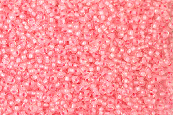 PRECIOSA rokajl 11/0 (2,0 - 2,2 mm) RH, bal. 50 g - krystal s růžovým průtahem a listrem
