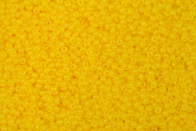 PRECIOSA rokajl 11/0 (2,0 - 2,2 mm) RH, bal. 50 g - tmavší žlutý solgel na alabastru