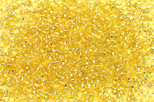 PRECIOSA rokajl 12/0 (1,8 - 2,0 mm) RH, bal. 50 g - transp. světlejší topaz, SL (zlatá)