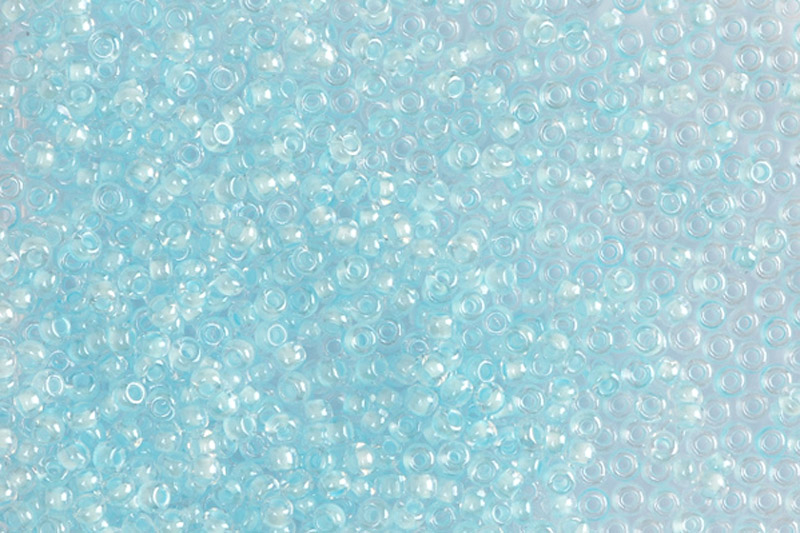 TOP PRECIOSA rokajl 10/0 (2,2 - 2,4 mm) RH, bal. 50 g - krystal, zelenomodrý vtah (38162)