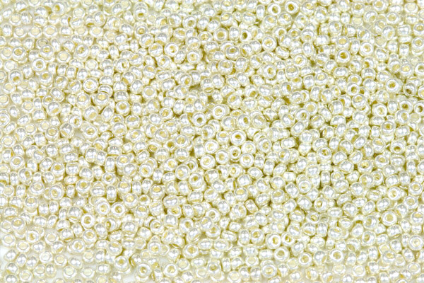 PRECIOSA rokajl 11/0 (2,0 - 2,2 mm) RH, bal. 50 g - terra metalická béžová, stříbrná