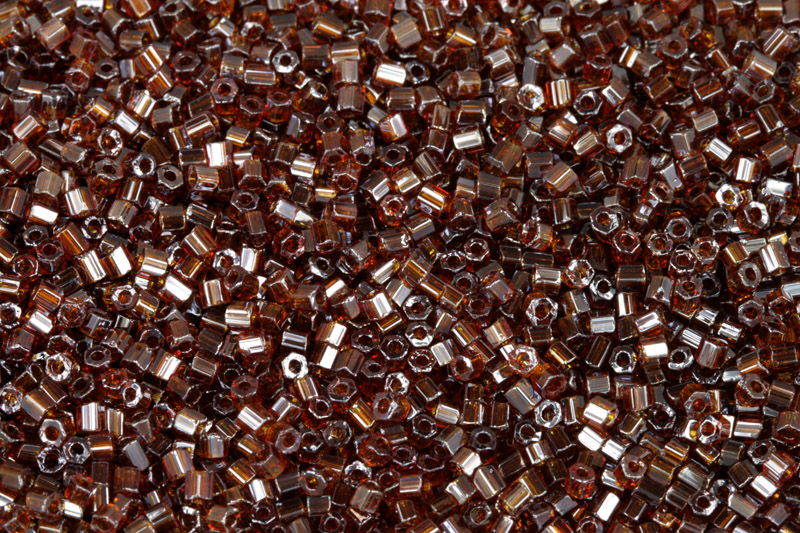 PRECIOSA dvoukrátky (2cuts) 10/0 (2,0-2,2 mm) RH, bal. 50 g - transp. topaz, sfinx