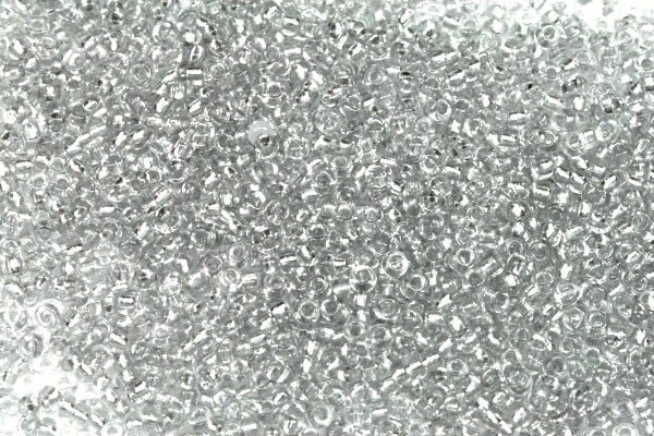 PRECIOSA rokajl 11/0 (2,0 - 2,2 mm) RH, bal. 50 g - krystal, metalický stříbrný vtah