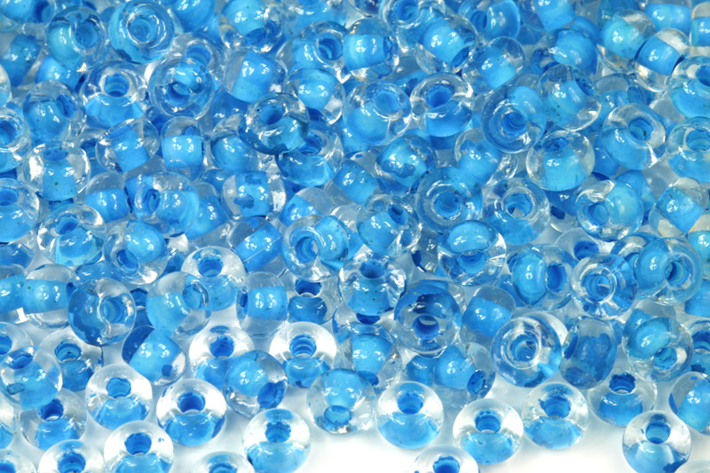 PRECIOSA rokajl 2/0 (5,8 - 6,3 mm) RH, bal. 50 g - krystal s modrým průtahem