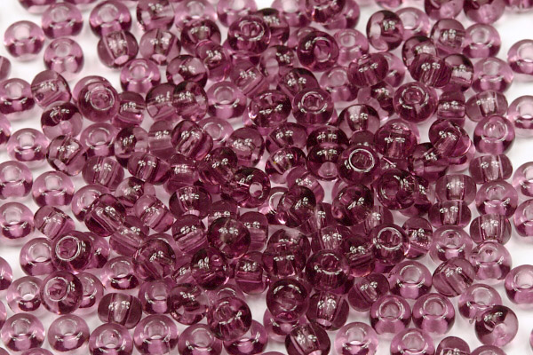 PRECIOSA rokajl 5/0 (4,3 - 4,8 mm) RH, bal. 50 g - transparentní ametystově fialová