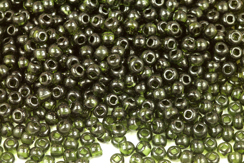 PRECIOSA rokajl 6/0 (3,7 - 4,3 mm) SH, bal. 50 g - transp. tmavě zelená, olivín