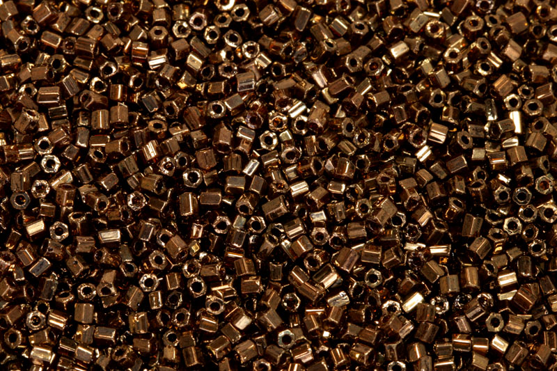 PRECIOSA dvoukrátky (2cuts) 10/0 (2,0-2,2 mm) RH, bal. 50 g - tm. topaz, bronz sfinx