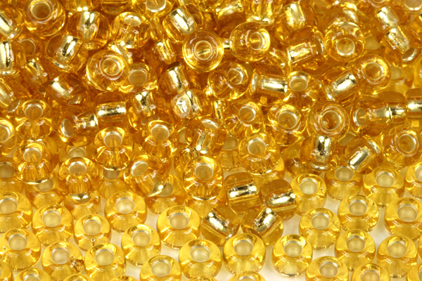 PRECIOSA rokajl 2/0 (5,8 - 6,3 mm) RH, bal. 50 g - transp. topaz, SL (zlatá)