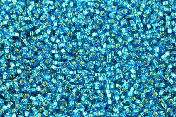 PRECIOSA rokajl 8/0 (2,8 - 3,2 mm) SH, bal. 50 g - transp. akvamarínově modrá, SL