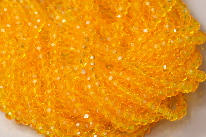 Broušené korálky slavík 3x2 mm, cca 145 ks na šňůře 36 cm - transp. oranžovožlutá