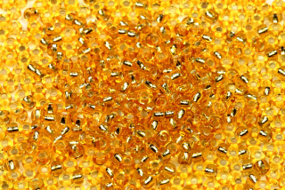 PRECIOSA rokajl 8/0 (2,8 - 3,2 mm) RH, bal. 50 g - transparentní topaz, SL (zlatá)