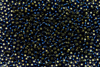 PRECIOSA rokajl 11/0 (2,0 - 2,2 mm) RH, bal. 50 g - transp. tmavě akvamarínově modrá, SL