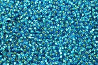 PRECIOSA rokajl 10/0 (2,2 - 2,4 mm) SH, bal. 50 g - transp. modrá akvamarín, SL