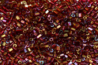 PRECIOSA dvoukrátky (2cuts) 9/0 (2,2 - 2,5 mm) RH, bal. 50 g - transp. rubín, rainbow