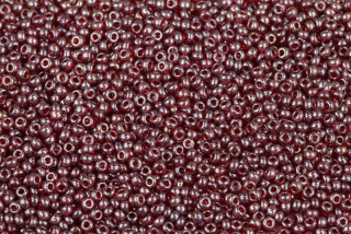 PRECIOSA rokajl 10/0 (2,2 - 2,4 mm) RH, bal. 50 g - transp. rubínově červená s listrem