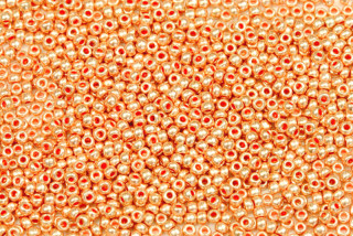 PRECIOSA rokajl 10/0 (2,2 - 2,4 mm) RH, bal. 50 g - metalická světle oranžová
