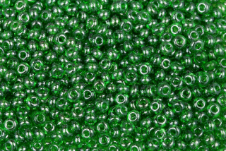 PRECIOSA rokajl 7/0 (3,2 - 3,7 mm) RH, bal. 50 g - transp. zelená s listrem, sfinx