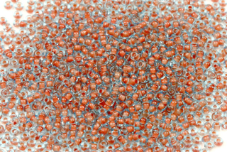 PRECIOSA rokajl 10/0 (2,2 - 2,4 mm) RH, bal. 50 g - transp. světle modrá s hnědým průtahem