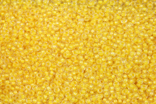 PRECIOSA rokajl 10/0 (2,2 - 2,4 mm) RH, bal. 50 g - krystal se žlutým průtahem