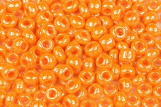PRECIOSA rokajl 1/0 (6,3 - 6,8 mm) RH, bal. 50 g - sytá oranžová s listrem, sfinx